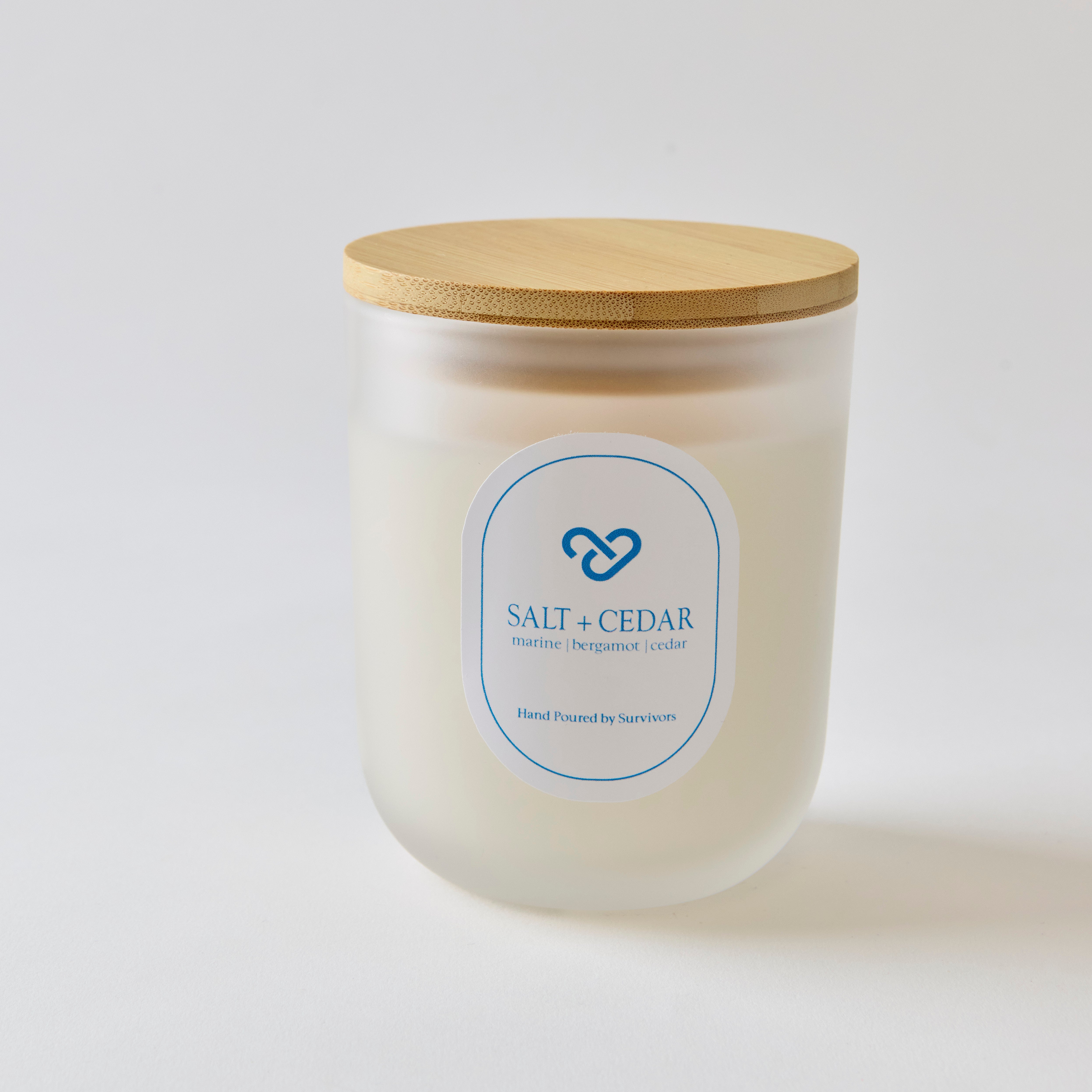 10oz candle frosted jar called salt + cedar