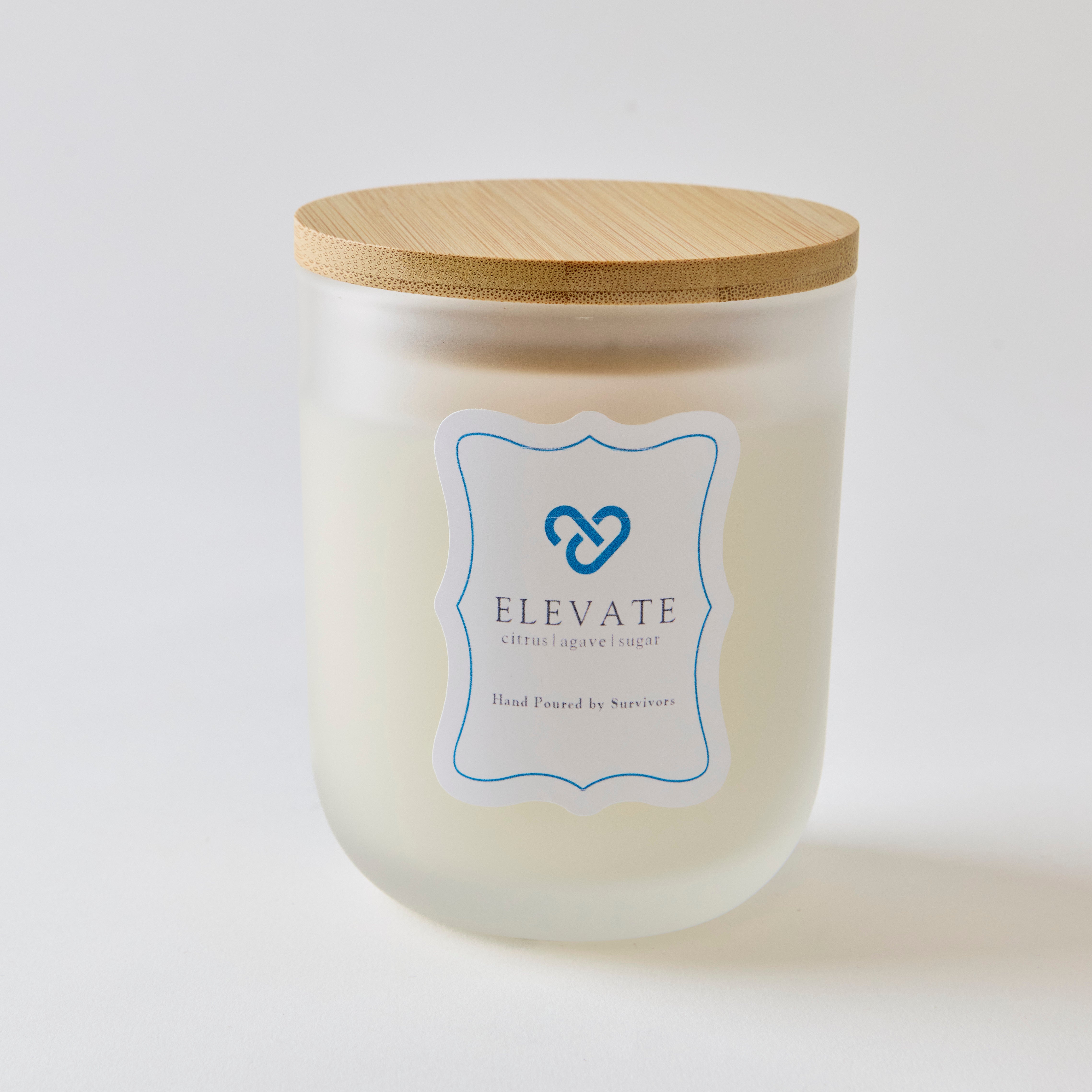 Candle in a frosted jar called ELEVATE 
